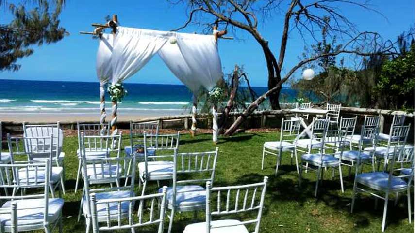 bamboo wedding arbor with loose fabric