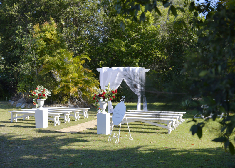 white washed benches for wedding