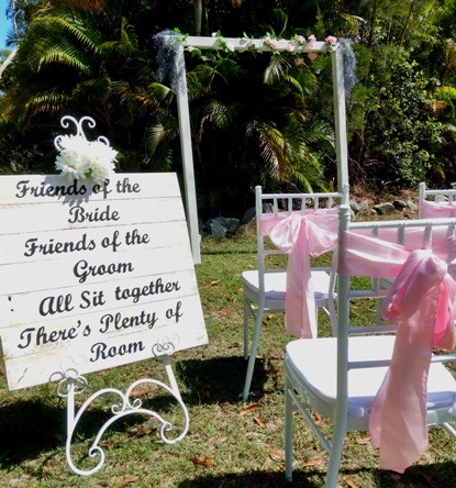 white metal easel with pallet sign